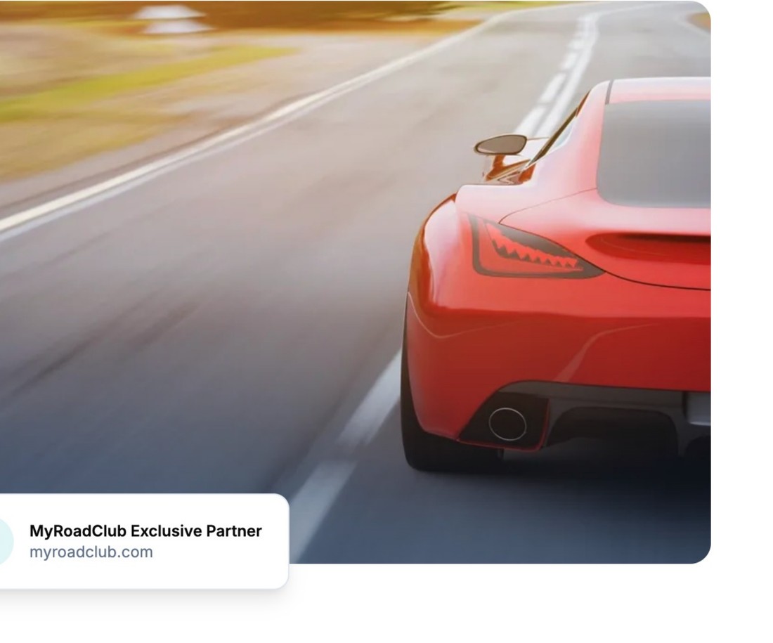 Sports car driving on an open road
